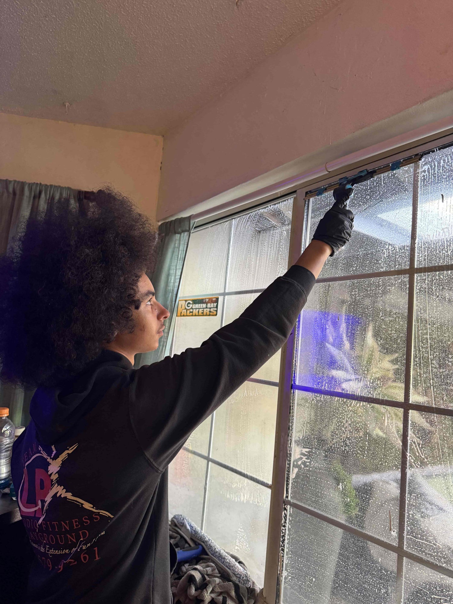 Gianni Focused on Window Cleaning residential with a Squeegee And Soapy water showing dedication & professional service in Santa Rosa